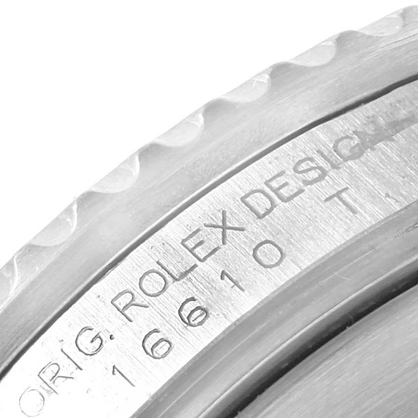 This close-up shows the edge and markings on the case back of a Rolex Submariner 16610 Men
s Stainless Steel Black Dial 16610 Men
s Stainless Steel Black Dial watch.