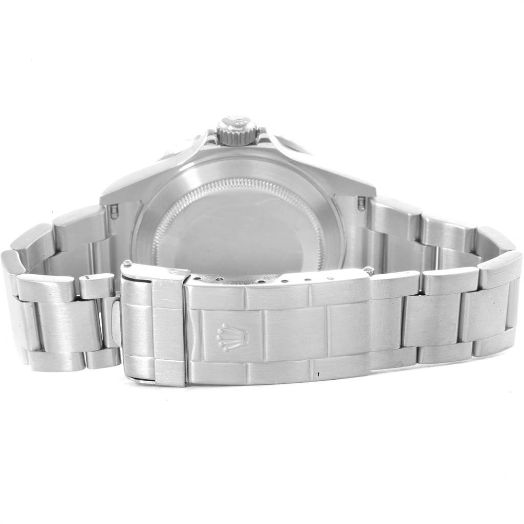 The image shows the back view of a Rolex Submariner 16610 Men
s Stainless Steel Black Dial 16610 Men
s Stainless Steel Black Dial watch, highlighting the stainless steel bracelet and closed clasp.