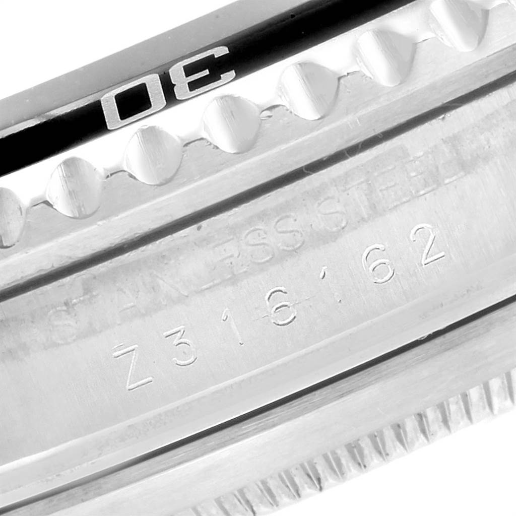 This close-up image shows the engraved bezel and case edge of a Rolex Submariner 16610 Men
s Stainless Steel Black Dial 16610 Men
s Stainless Steel Black Dial watch.