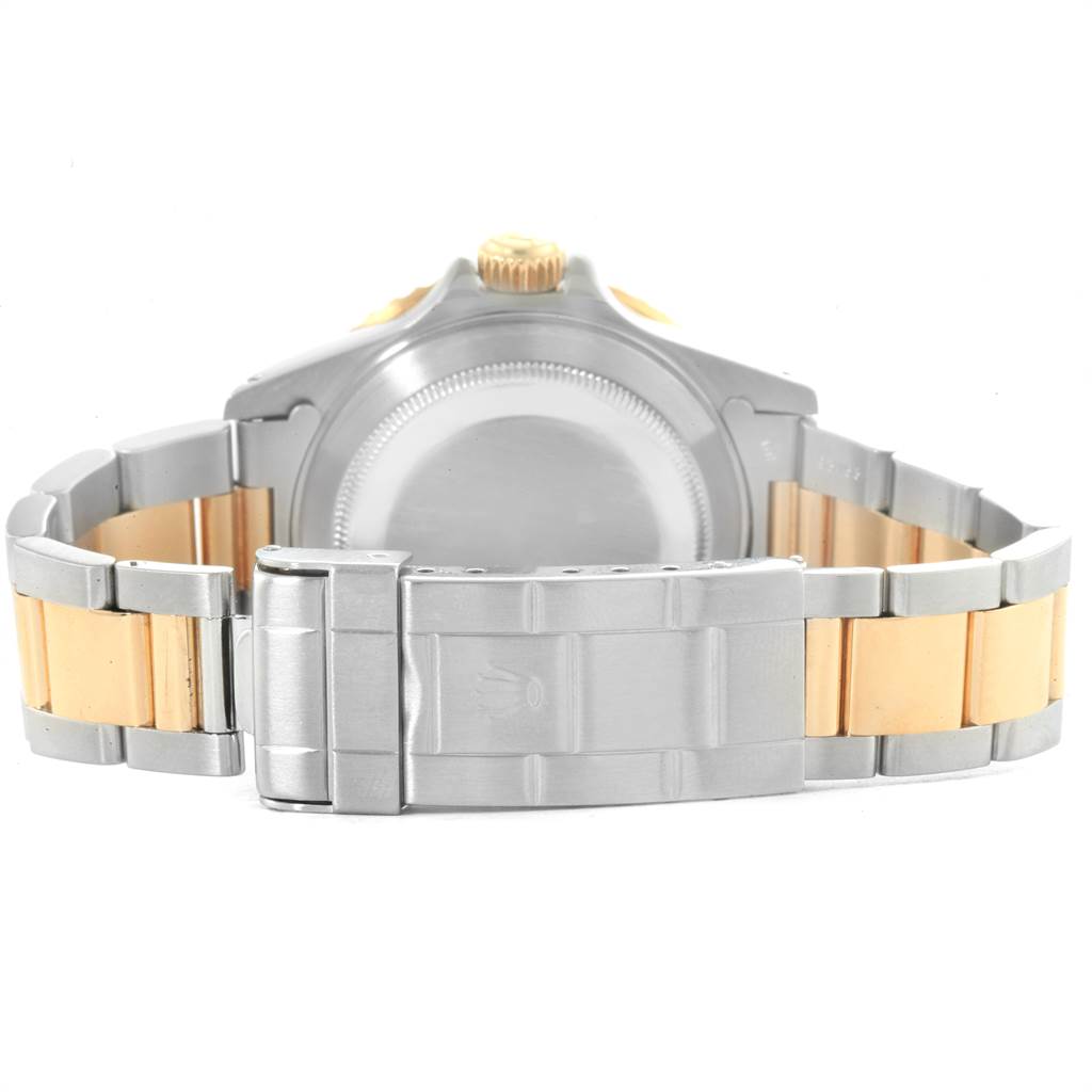 The image shows the back view of the Rolex Submariner 16613 Men
s Steel and Gold (two tone) Blue Dial 16613 Men
s Steel and Gold (two tone) Blue Dial watch, highlighting its two-tone metal bracelet and clasp.