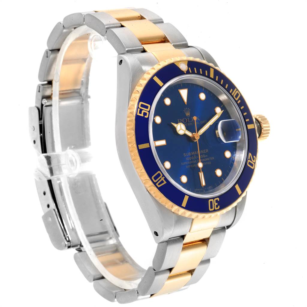 This Rolex Submariner 16613 Men
s Steel and Gold (two tone) Blue Dial 16613 Men
s Steel and Gold (two tone) Blue Dial watch is shown at a three-quarter angle, highlighting the blue bezel, dial, and two-tone bracelet.