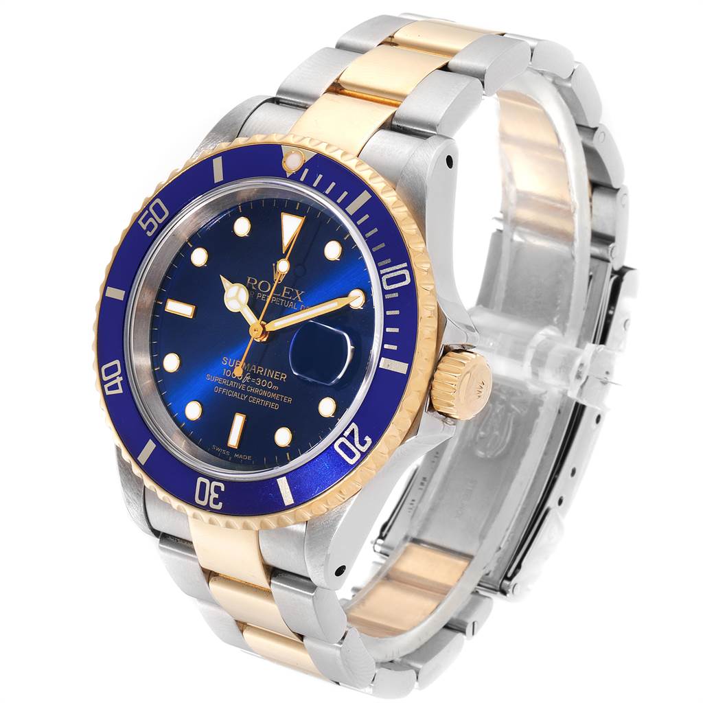 The Rolex Submariner 16613 Men
s Steel and Gold (two tone) Blue Dial 16613 Men
s Steel and Gold (two tone) Blue Dial watch is shown at a three-quarter angle, displaying the face, bezel, crown, and two-tone bracelet.