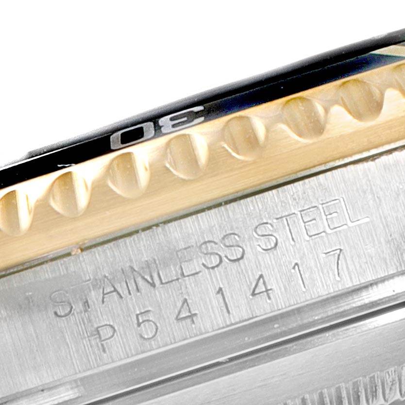 The image shows a close-up of the stainless steel case and bezel of a Rolex Submariner 16613 Men
s Steel and Gold (two tone) Blue Dial 16613 Men
s Steel and Gold (two tone) Blue Dial watch.