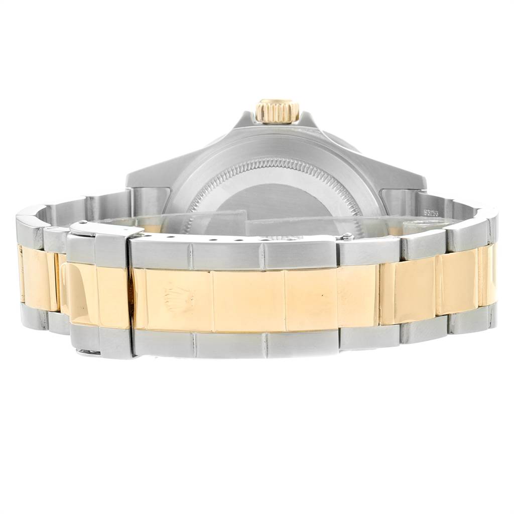 The image shows the back view of a Rolex Submariner 16613 Men
s Steel and Gold (two tone) Blue Dial 16613 Men
s Steel and Gold (two tone) Blue Dial, highlighting the two-tone bracelet and case back.