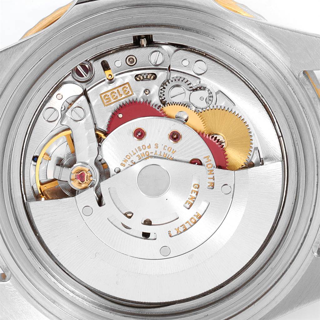 The image shows the internal mechanism and components of a Rolex Submariner 16613 Men
s Steel and Gold (two tone) Blue Dial 16613 Men
s Steel and Gold (two tone) Blue Dial watch from a back angle.