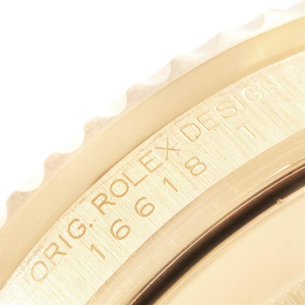 The image shows a close-up view of the casing and engraved model number of the Rolex Submariner 16618 Men
s Yellow Gold Black Dial 16618 Men
s Yellow Gold Black Dial watch.