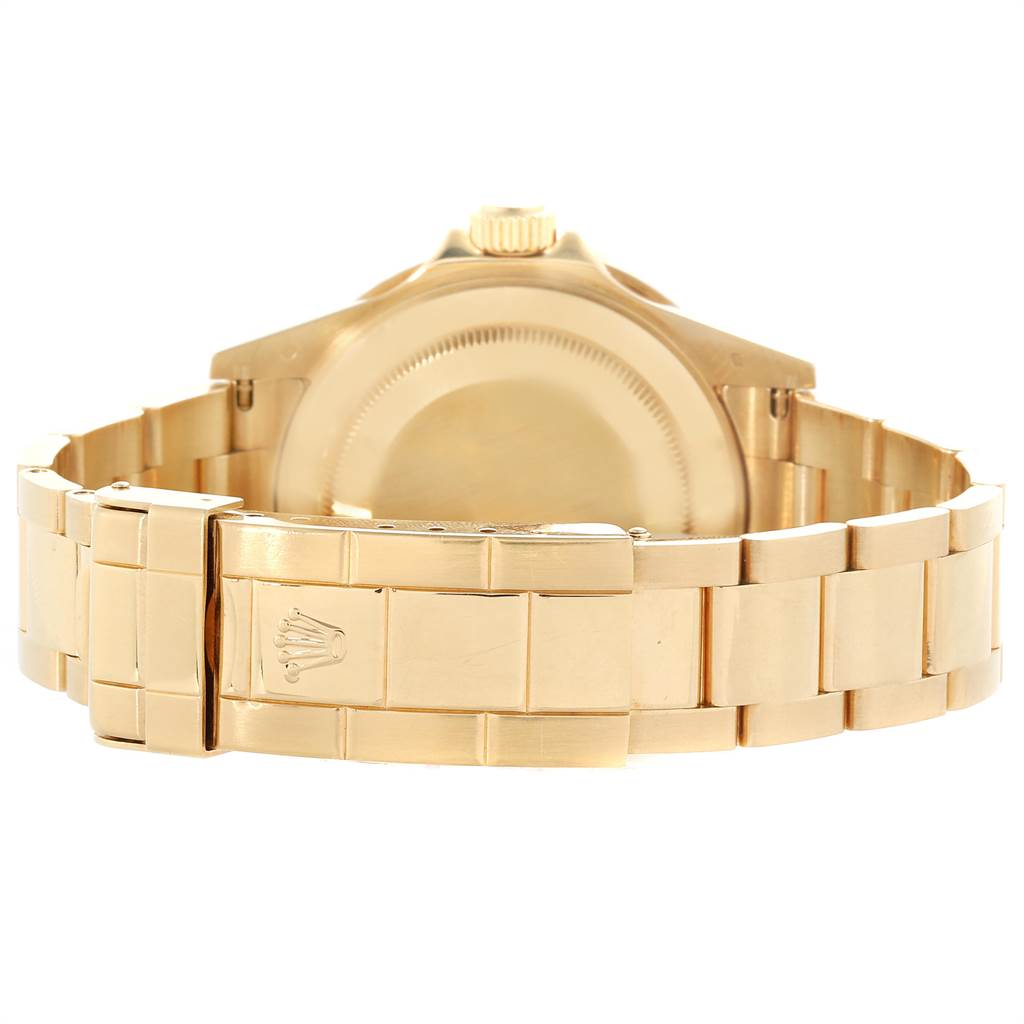 This image shows the back view of a Rolex Submariner 16618 Men
s Yellow Gold Black Dial 16618 Men
s Yellow Gold Black Dial watch, focusing on the case back and bracelet with the clasp.