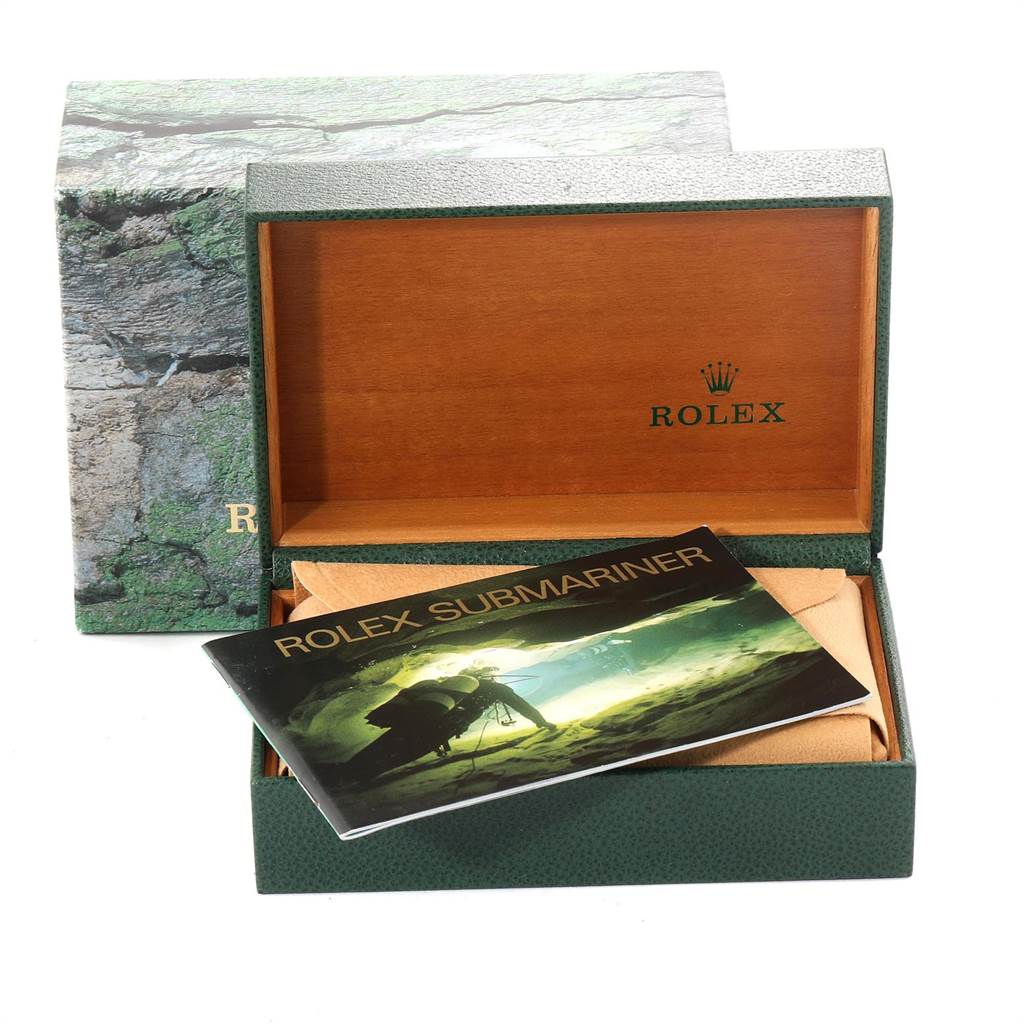 The image shows an open Rolex Submariner 16613 Men
s Steel and Gold (two tone) Blue Dial 16613 Men
s Steel and Gold (two tone) Blue Dial box with the user manual visible, but no watch inside.