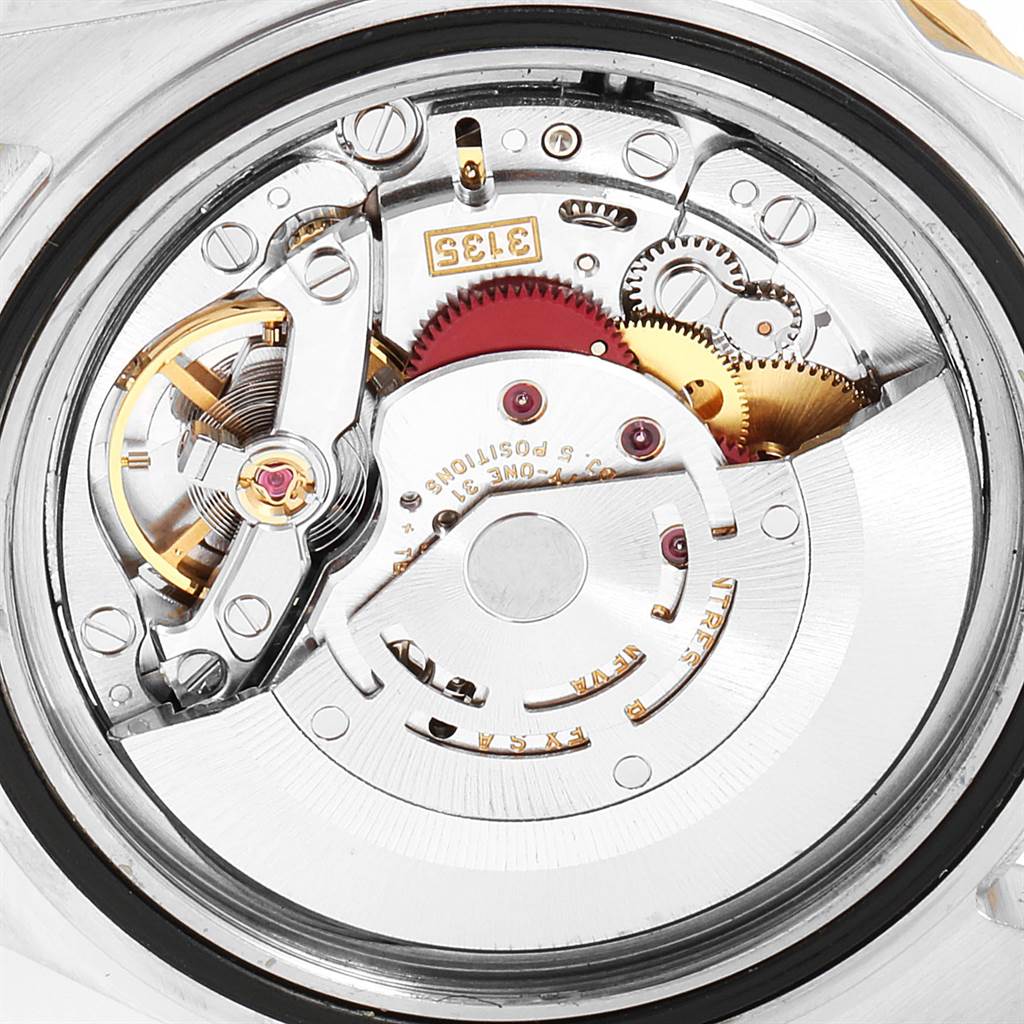This image shows a close-up view of the internal movement mechanism of a Rolex Submariner 16613 Men
s Steel and Gold (two tone) Blue Dial 16613 Men
s Steel and Gold (two tone) Blue Dial watch.