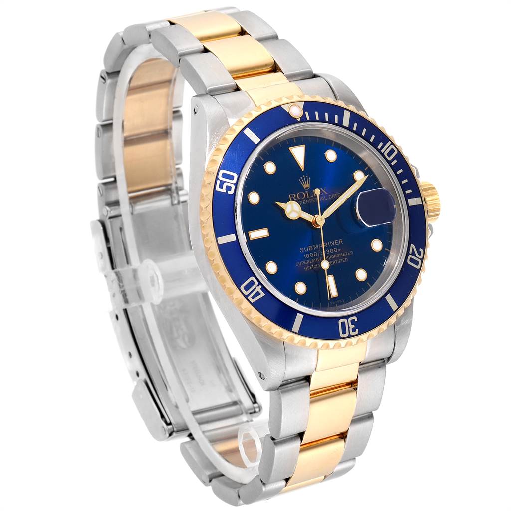 This Rolex Submariner 16613 Men
s Steel and Gold (two tone) Blue Dial 16613 Men
s Steel and Gold (two tone) Blue Dial watch is shown at an angle highlighting its blue dial, bezel, and two-tone bracelet.
