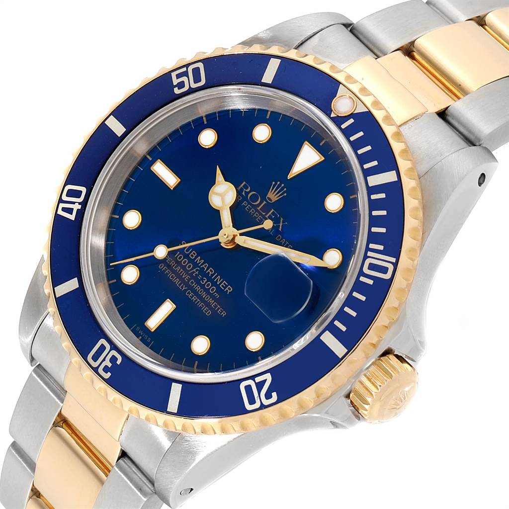 This image shows a Rolex Submariner 16613 Men
s Steel and Gold (two tone) Blue Dial 16613 Men
s Steel and Gold (two tone) Blue Dial watch at an angle displaying its blue dial, gold and silver bracelet, and crown.