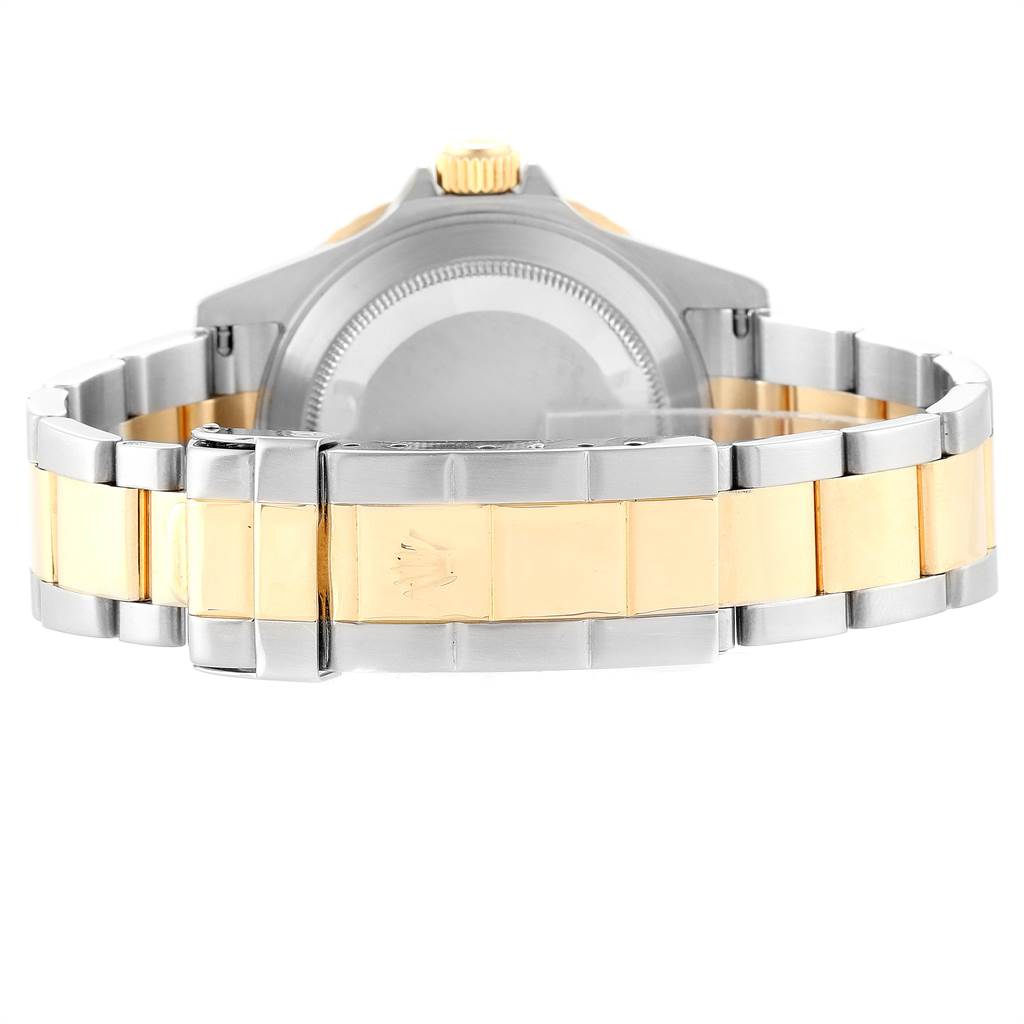 The image shows the backside of a Rolex Submariner 16613 Men's Steel and Gold (two tone) Champagne Dial 16613 Men's Steel and Gold (two tone) Champagne Dial watch, focusing on the two-tone bracelet and clasp.