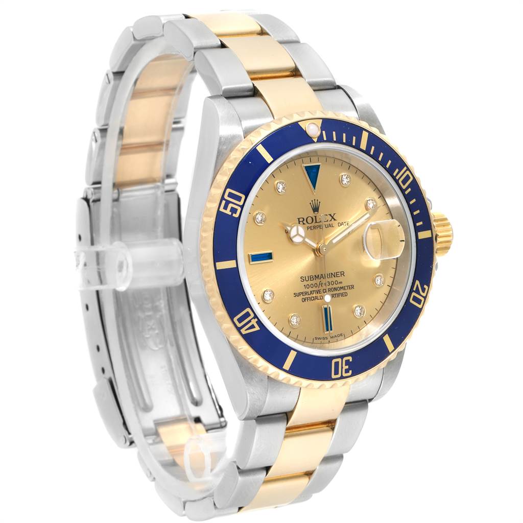The Rolex Submariner 16613 Men's Steel and Gold (two tone) Champagne Dial 16613 Men's Steel and Gold (two tone) Champagne Dial model is shown at a slight angle, highlighting the blue bezel, gold dial, and two-tone bracelet.