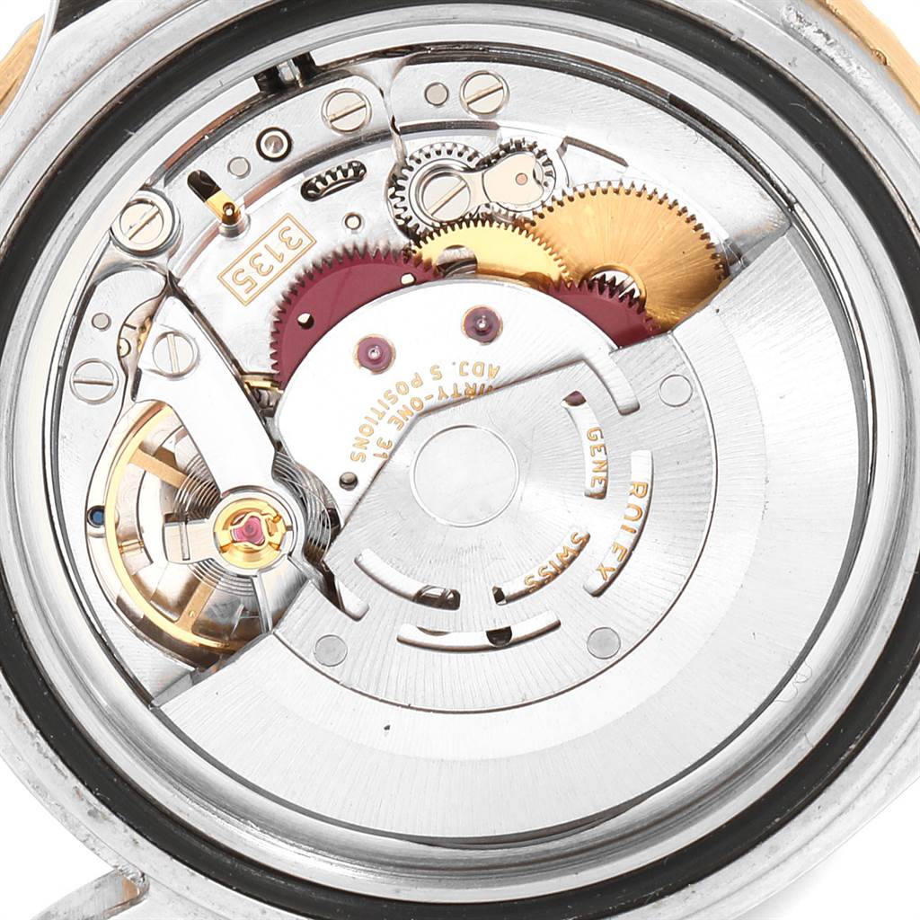 The image shows the internal mechanical movement of a Rolex Submariner 16613 Men's Steel and Gold (two tone) Champagne Dial 16613 Men's Steel and Gold (two tone) Champagne Dial watch.
