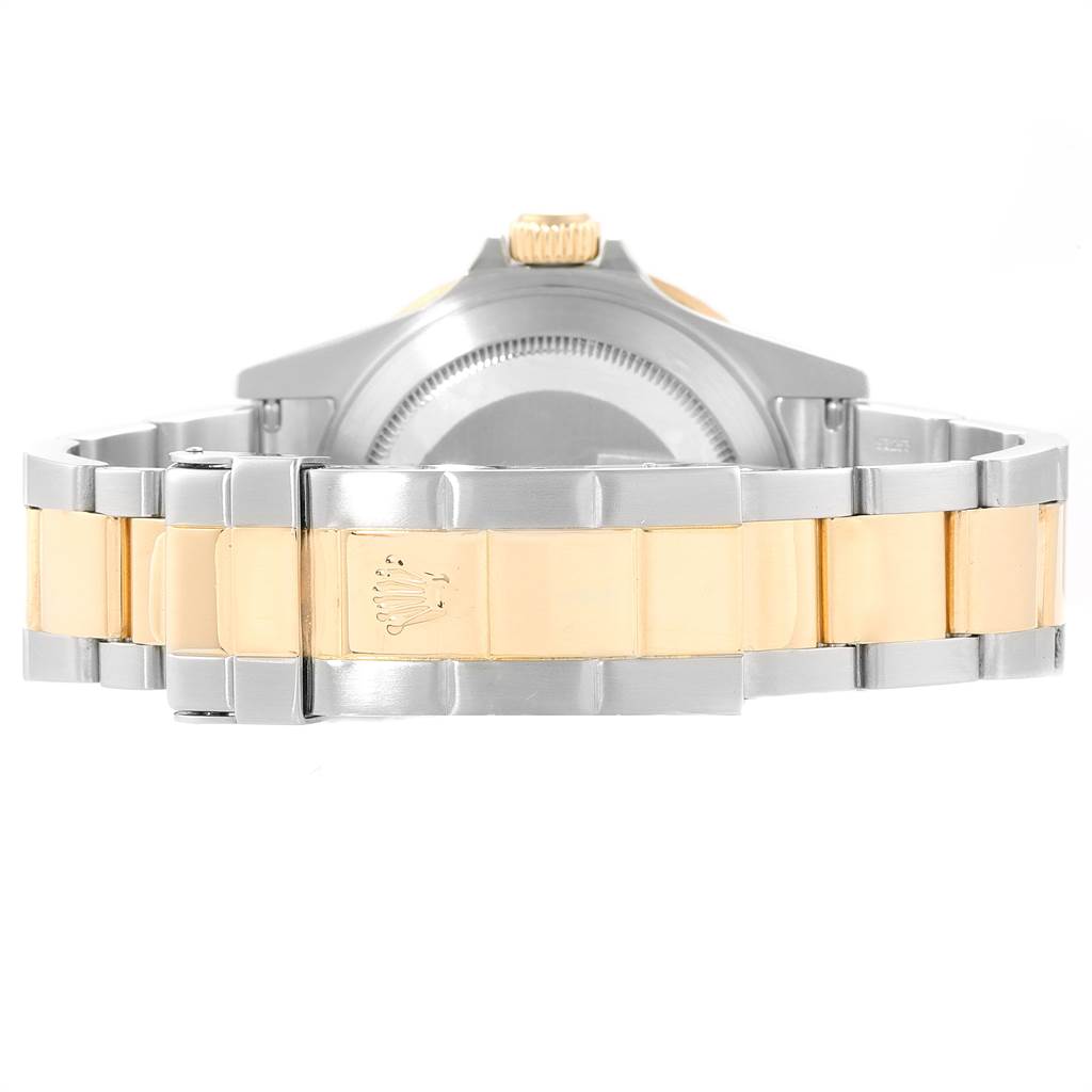 The image shows the back and bracelet of a Rolex Submariner 16613 Men
s Steel and Gold (two tone) Blue Dial 16613 Men
s Steel and Gold (two tone) Blue Dial, highlighting its two-tone metal links and clasp.