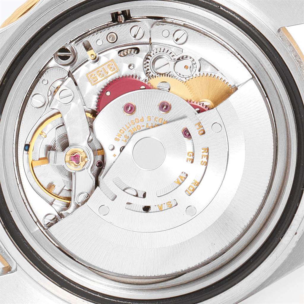 This image shows the internal mechanical movement of the Rolex Submariner 16613 Men
s Steel and Gold (two tone) Blue Dial 16613 Men
s Steel and Gold (two tone) Blue Dial watch from a back view.