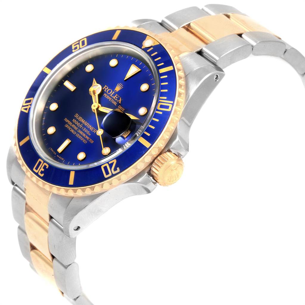 The image shows a Rolex Submariner 16613 Men
s Steel and Gold (two tone) Blue Dial 16613 Men
s Steel and Gold (two tone) Blue Dial watch from an angled side view, displaying its blue dial, gold bezel, crown, and two-tone bracelet.