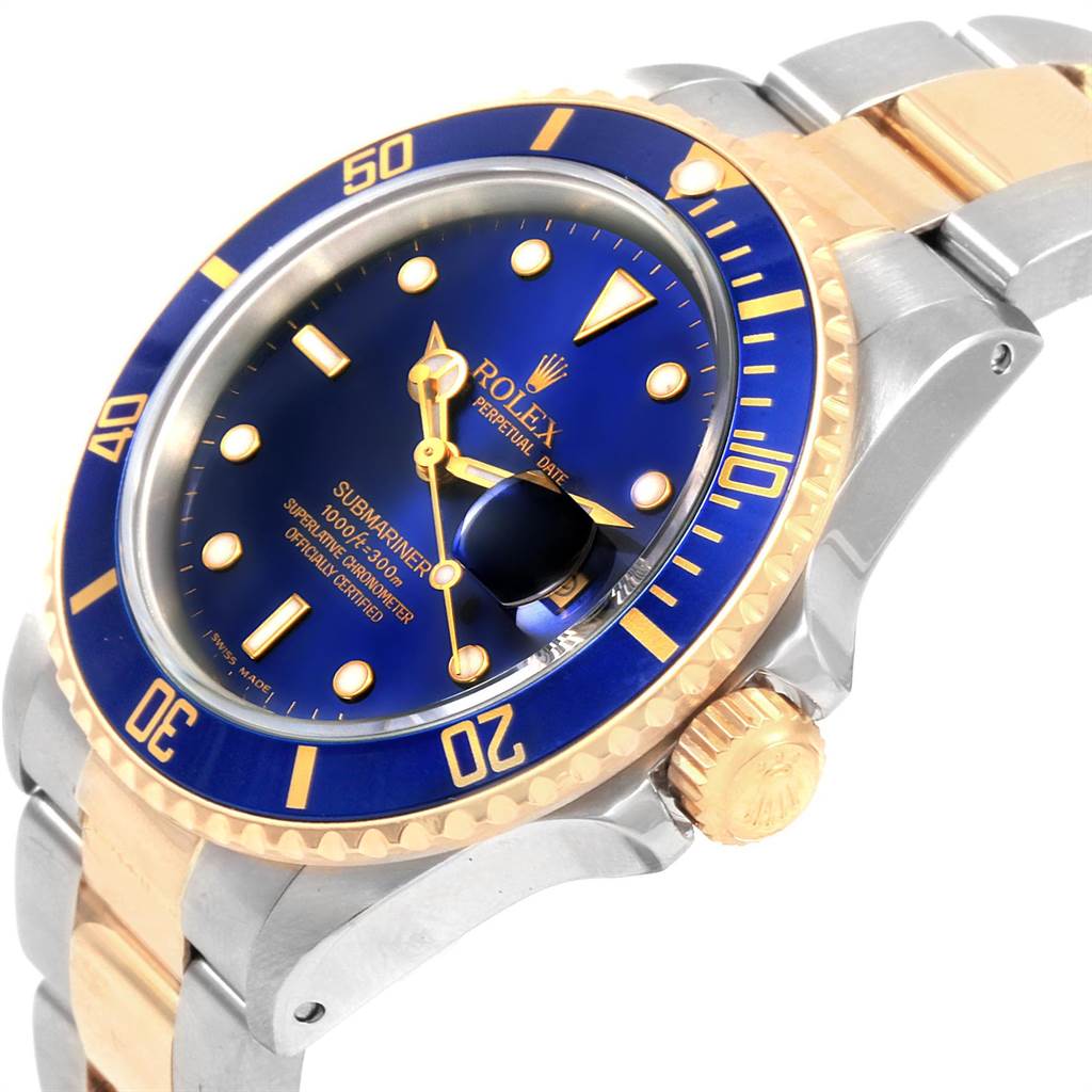 The angled view shows the Rolex Submariner 16613 Men
s Steel and Gold (two tone) Blue Dial 16613 Men
s Steel and Gold (two tone) Blue Dial
s blue dial, bezel, crown, and part of the two-tone bracelet.