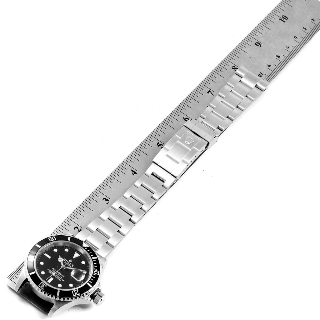 The image shows a top-down view of a Rolex Submariner 16610 Men
s Stainless Steel Black Dial 16610 Men
s Stainless Steel Black Dial watch, displaying the face, bezel, and metal bracelet.