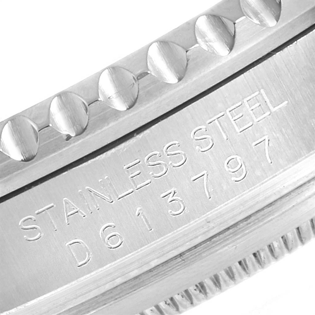 The image shows a close-up of the caseback edge and part of the bezel of a stainless steel Rolex Submariner 16610 Men
s Stainless Steel Black Dial 16610 Men
s Stainless Steel Black Dial, including the serial number.