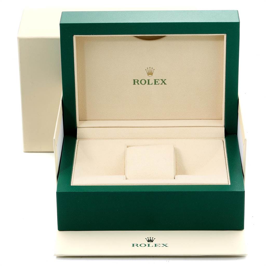 This image shows an open green and beige Rolex box for the Submariner model, displaying the interior but no watch.