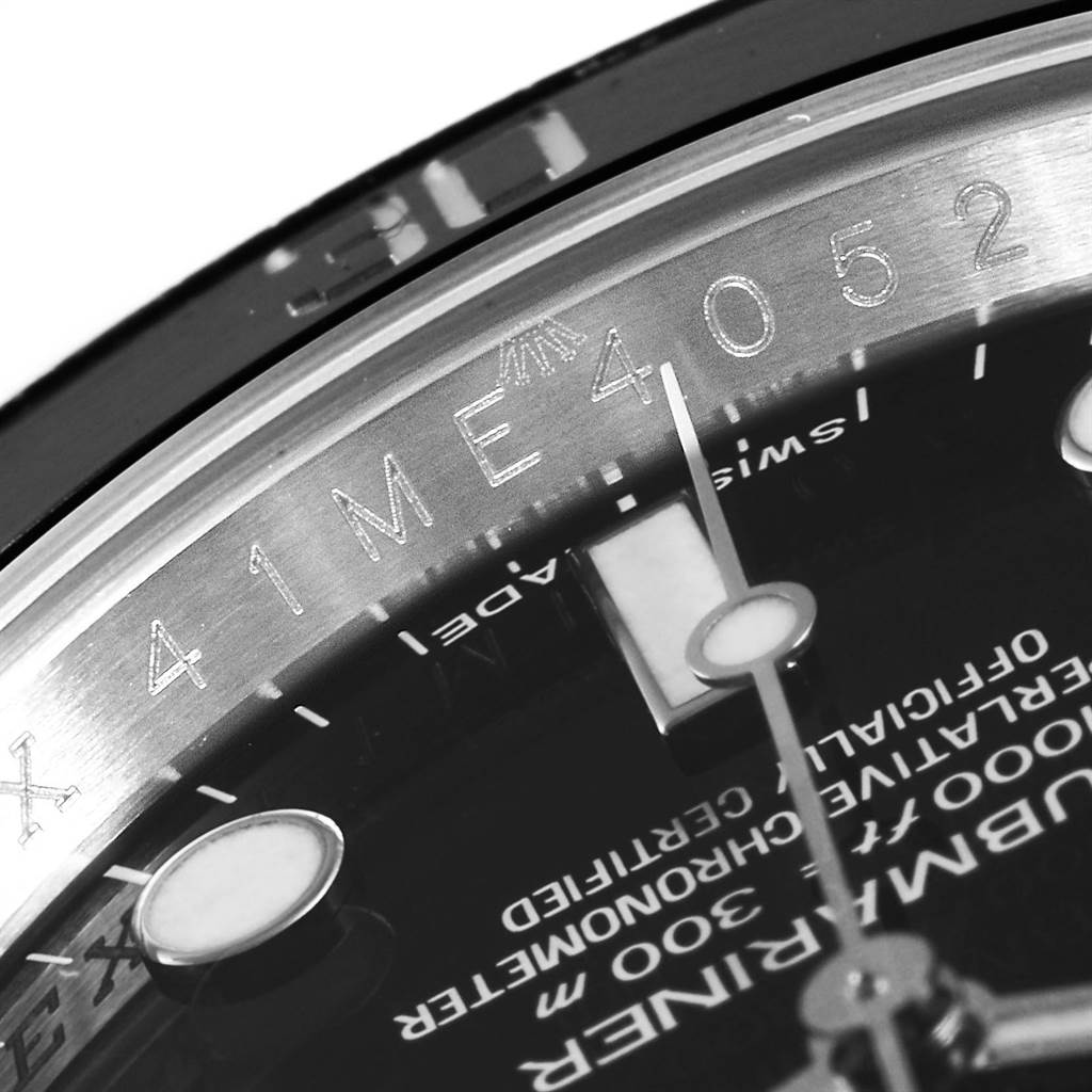 This close-up angle captures part of the dial and the rehaut of a Rolex Submariner 114060 Men's Stainless Steel Black Dial 114060 Men's Stainless Steel Black Dial model.