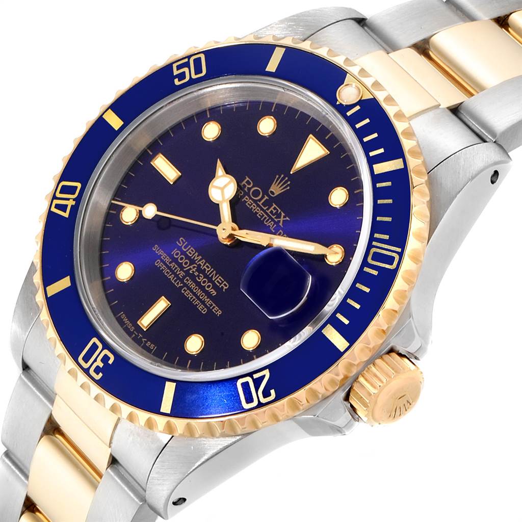 The image shows a close-up angled view of the Rolex Submariner 16613 Men
s Steel and Gold (two tone) Blue Dial 16613 Men
s Steel and Gold (two tone) Blue Dial watch, highlighting its dial, bezel, crown, and part of the bracelet.