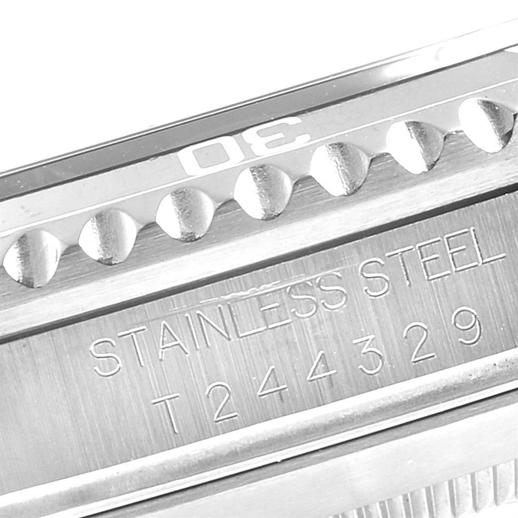 The close-up image shows the bezel and part of the case back of the Rolex Submariner 16610 Men
s Stainless Steel Black Dial 16610 Men
s Stainless Steel Black Dial, including the "STAINLESS STEEL" engraving.