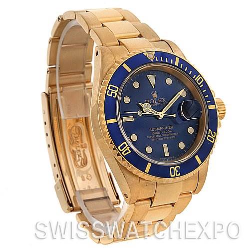 This image shows a Rolex Submariner 16618 Men's Stainless Steel Blue Dial 16618 Men's Stainless Steel Blue Dial watch from a front-left angle, showcasing its blue dial, bezel, and gold bracelet.