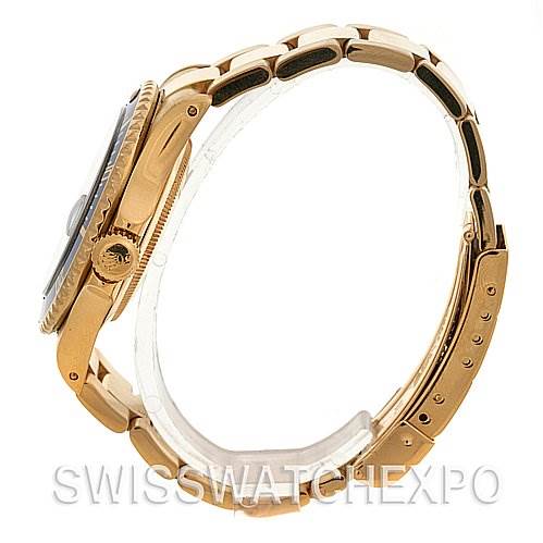 This image shows a side angle of a Rolex Submariner 16618 Men's Stainless Steel Blue Dial 16618 Men's Stainless Steel Blue Dial watch, highlighting the crown, bezel, and part of the bracelet.