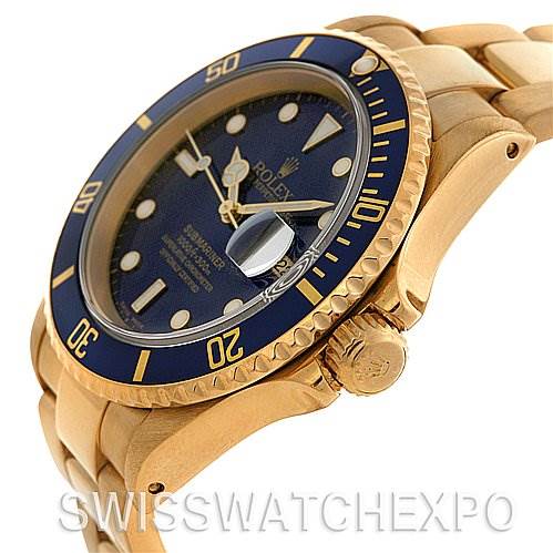 The image shows the angled side view of a Rolex Submariner 16618 Men's Stainless Steel Blue Dial 16618 Men's Stainless Steel Blue Dial watch, highlighting its blue dial, bezel, and gold bracelet.