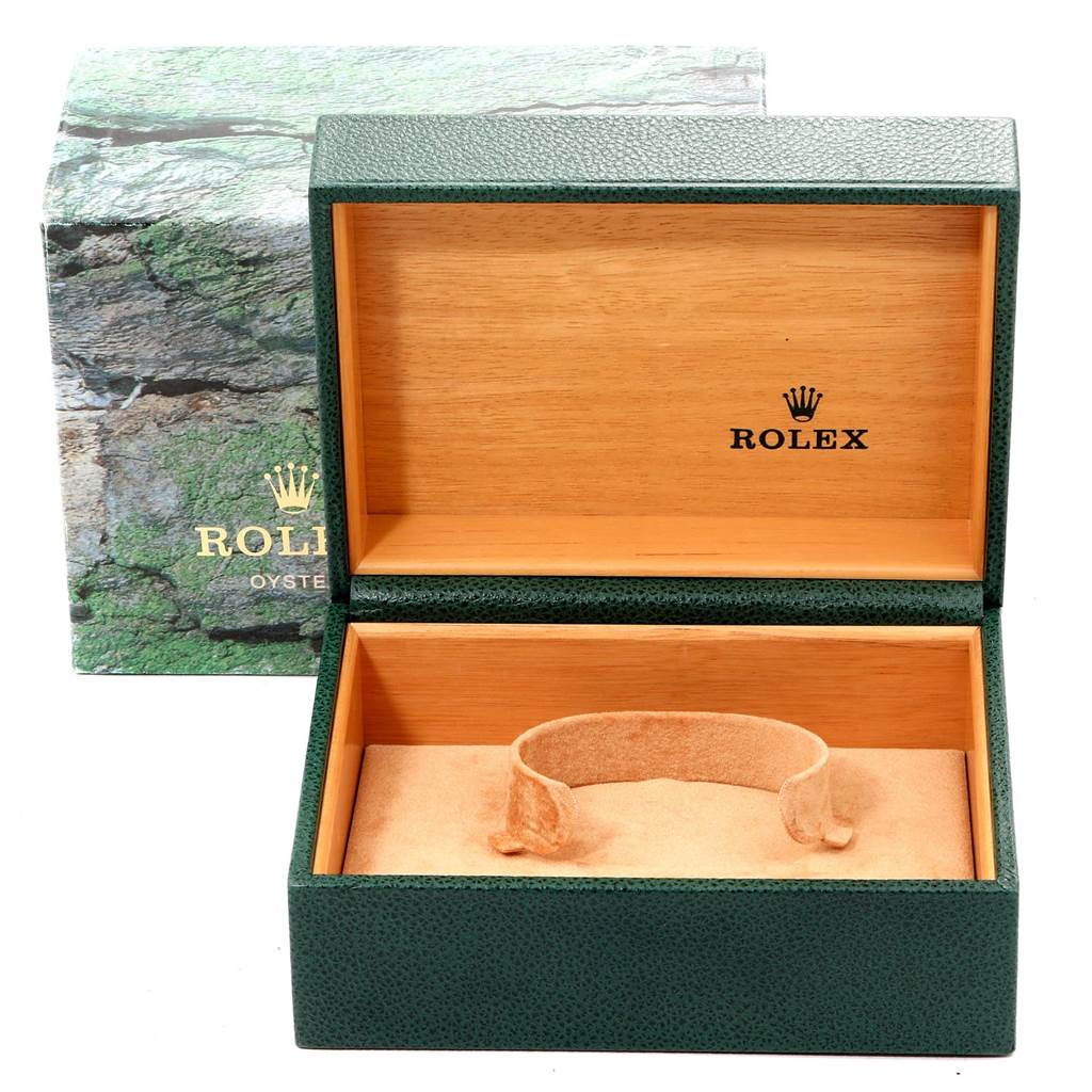 The image shows an open Rolex Submariner 14060 Men's Stainless Steel Black Dial 14060 Men's Stainless Steel Black Dial watch box, featuring the inner wooden and green textured parts.