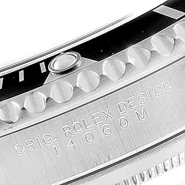 Close-up view of the casing and bezel of a Rolex Submariner 14060 Men's Stainless Steel Black Dial 14060 Men's Stainless Steel Black Dial, displaying part of the model number and design engraving.