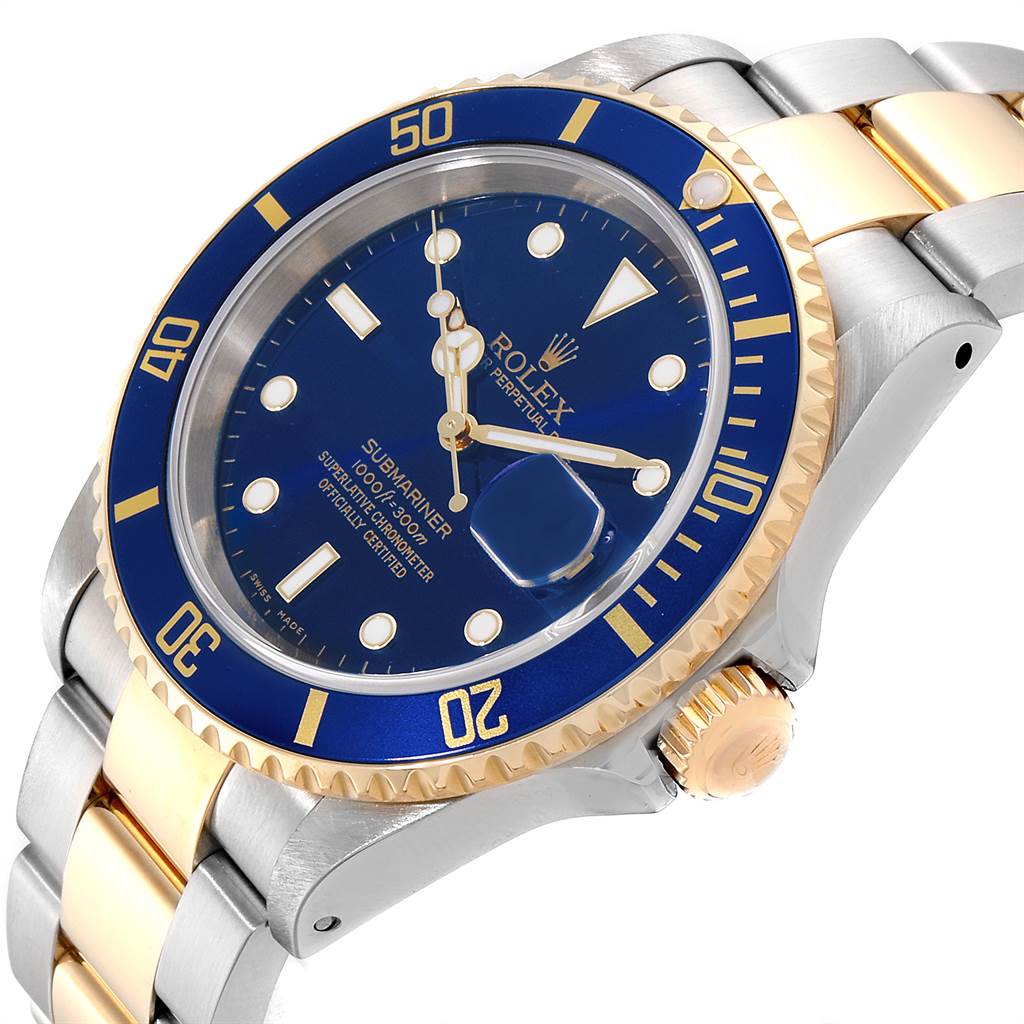 This image shows a Rolex Submariner 16613 Men's Steel and Gold (two tone) Blue Dial 16613 Men's Steel and Gold (two tone) Blue Dial watch at an oblique angle, highlighting the blue dial, bezel, and two-tone bracelet.