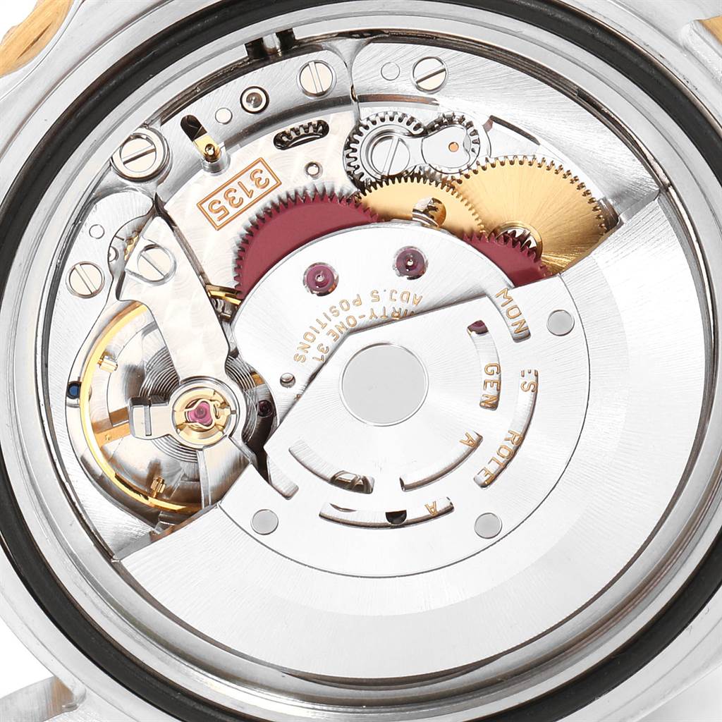 This image shows the intricate internal mechanism of a Rolex Submariner 16613 Men's Steel and Gold (two tone) Blue Dial 16613 Men's Steel and Gold (two tone) Blue Dial watch from a rear angle.