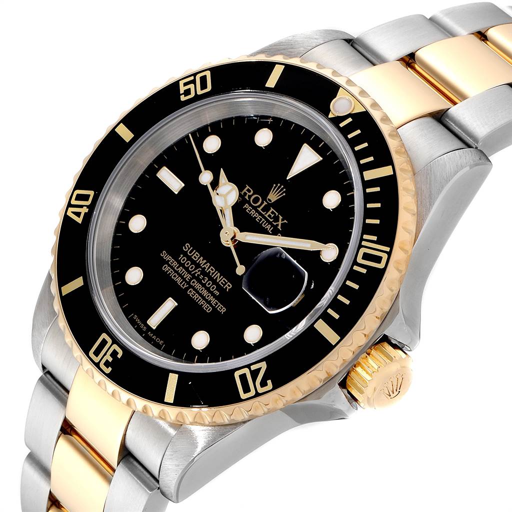 The image shows a Rolex Submariner 16613 Men
s Steel and Gold (two tone) Black Dial 16613 Men
s Steel and Gold (two tone) Black Dial watch angled to highlight the bezel, dial, crown, and two-tone bracelet.
