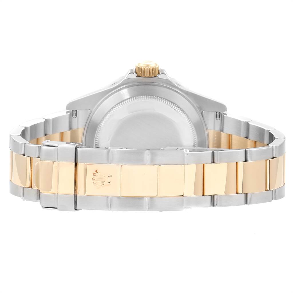 The image shows the back of a Rolex Submariner 16613 Men
s Steel and Gold (two tone) Black Dial 16613 Men
s Steel and Gold (two tone) Black Dial watch, focusing on the clasp and bracelet with a two-tone design.