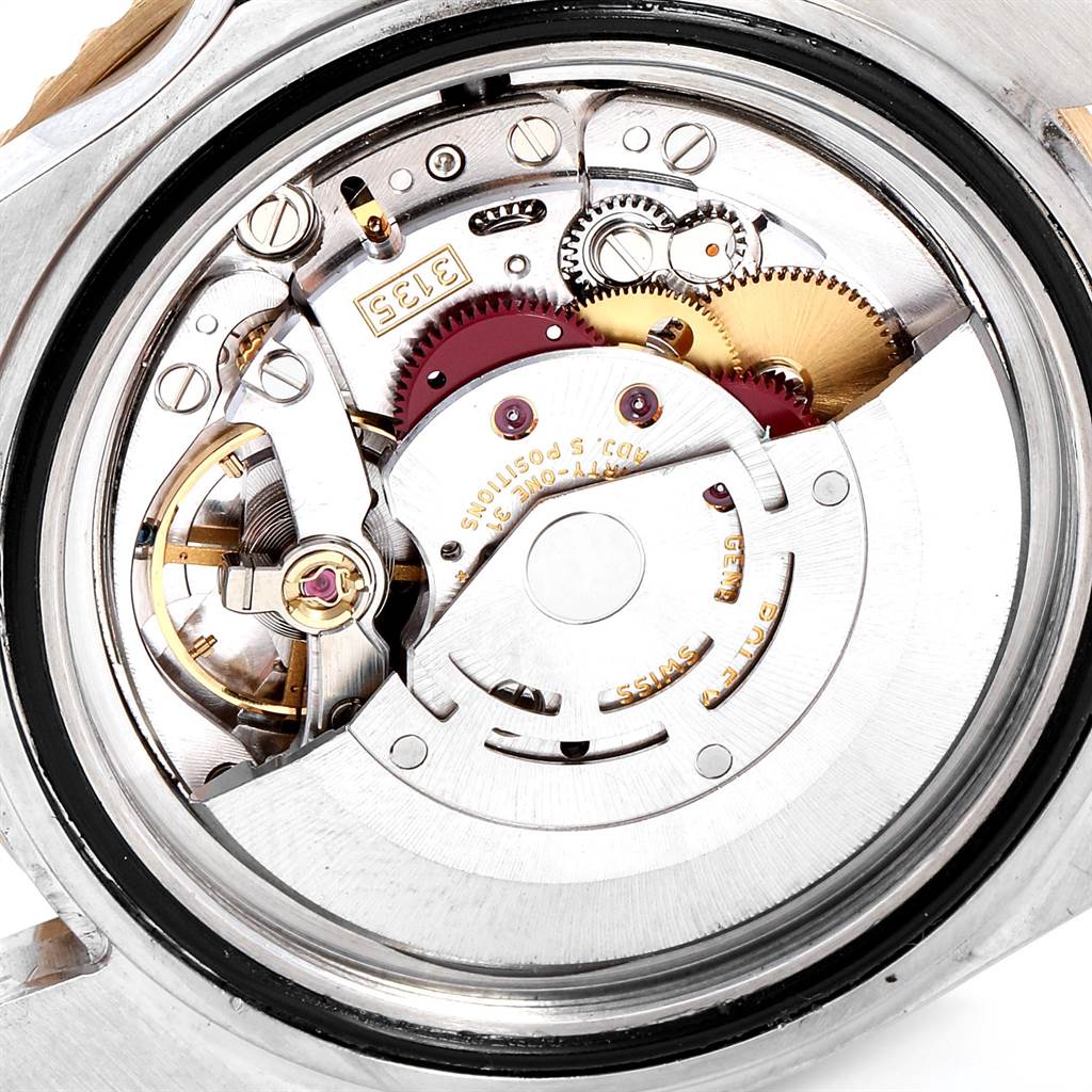 The image shows the internal mechanical movement of the Rolex Submariner 16613 Men
s Steel and Gold (two tone) Black Dial 16613 Men
s Steel and Gold (two tone) Black Dial watch from a rear angle.