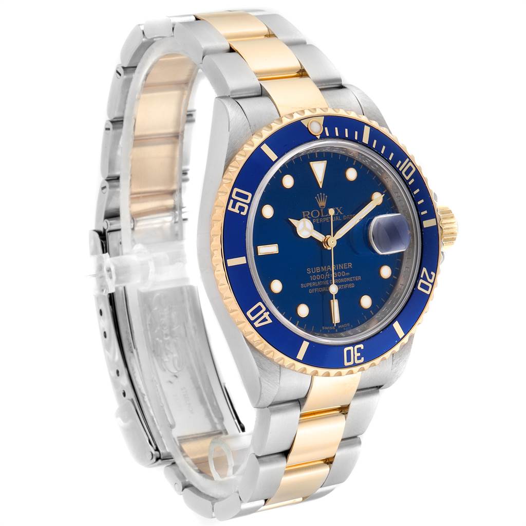 The Rolex Submariner 16613 Men
s Steel and Gold (two tone) Blue Dial 16613 Men
s Steel and Gold (two tone) Blue Dial watch is shown at an angle, highlighting its blue dial, bezel, and two-tone bracelet.