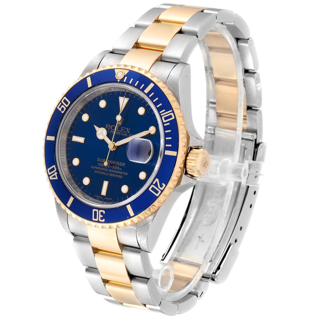 The image shows a Rolex Submariner 16613 Men
s Steel and Gold (two tone) Blue Dial 16613 Men
s Steel and Gold (two tone) Blue Dial watch at a slight angle displaying the dial, bezel, crown, and part of the bracelet.