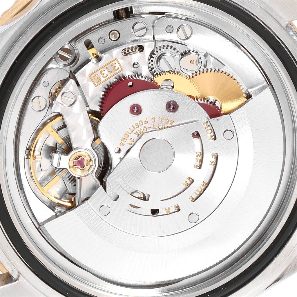 This image shows a close-up of the movement mechanism inside a Rolex Submariner 16613 Men
s Steel and Gold (two tone) Blue Dial 16613 Men
s Steel and Gold (two tone) Blue Dial watch.