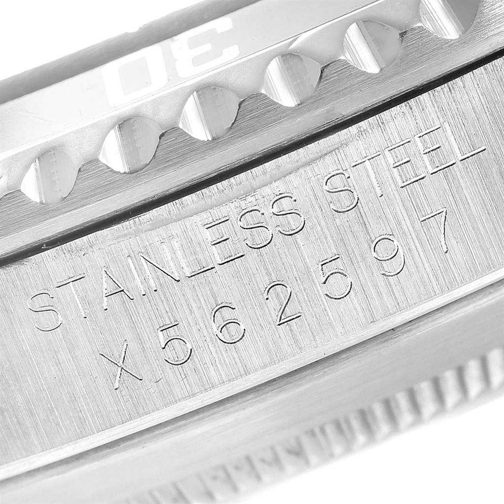 This close-up angle shows the side of the bezel and the engraved stainless steel serial number of the Rolex Submariner 14060 Men
s Stainless Steel Black Dial 14060 Men
s Stainless Steel Black Dial watch.