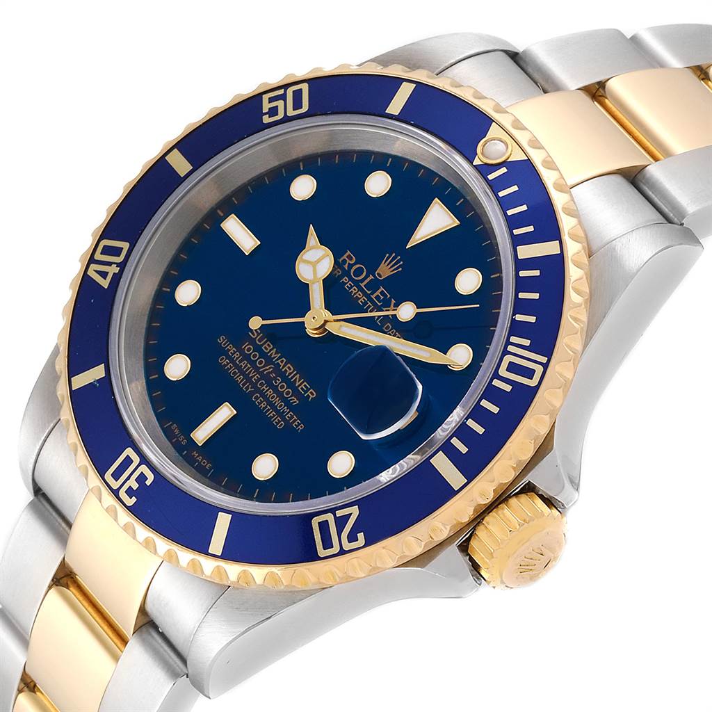 The image shows a close-up angle of the Rolex Submariner 16613 Men
s Steel and Gold (two tone) Blue Dial 16613 Men
s Steel and Gold (two tone) Blue Dial, highlighting its blue and gold bezel, dial, and part of its bracelet.