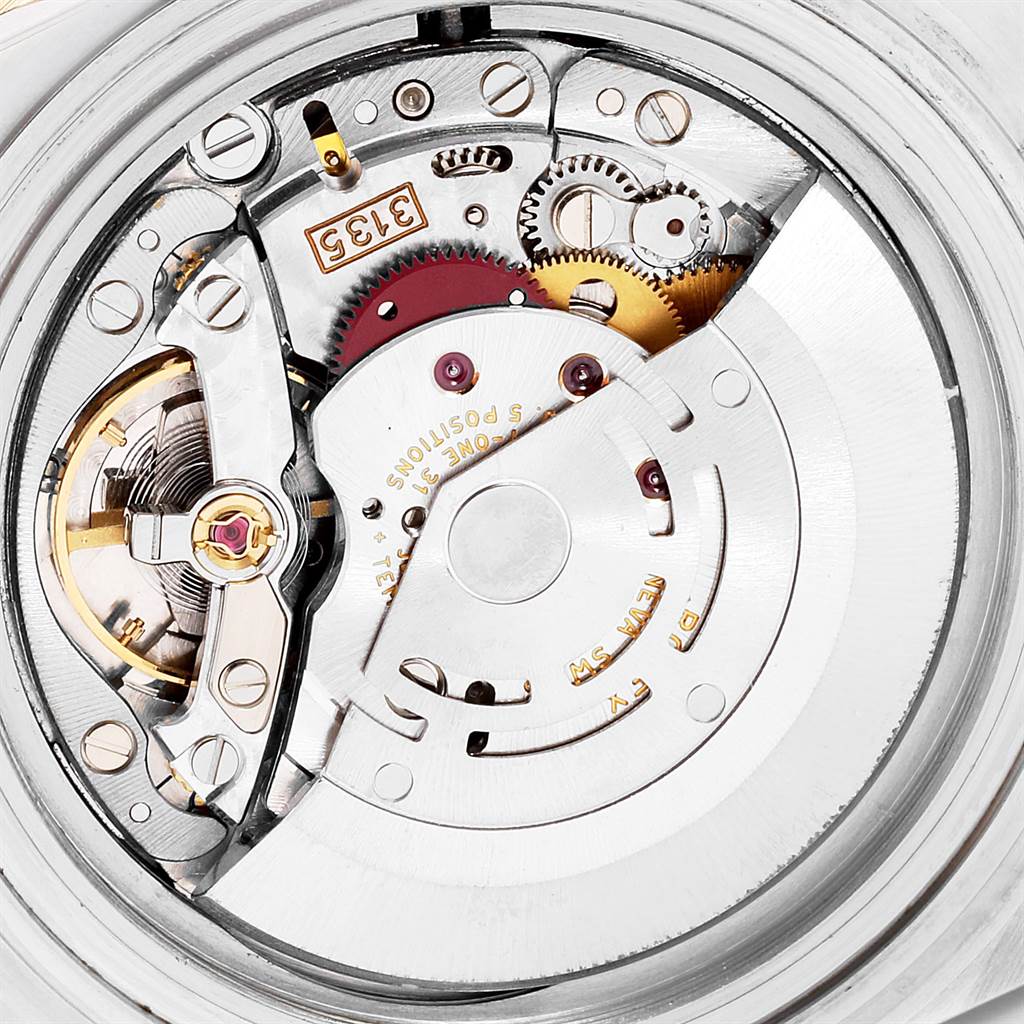 This image shows a close-up, detailed view of the movement mechanism of a Rolex Submariner 16613 Men
s Steel and Gold (two tone) Blue Dial 16613 Men
s Steel and Gold (two tone) Blue Dial watch.