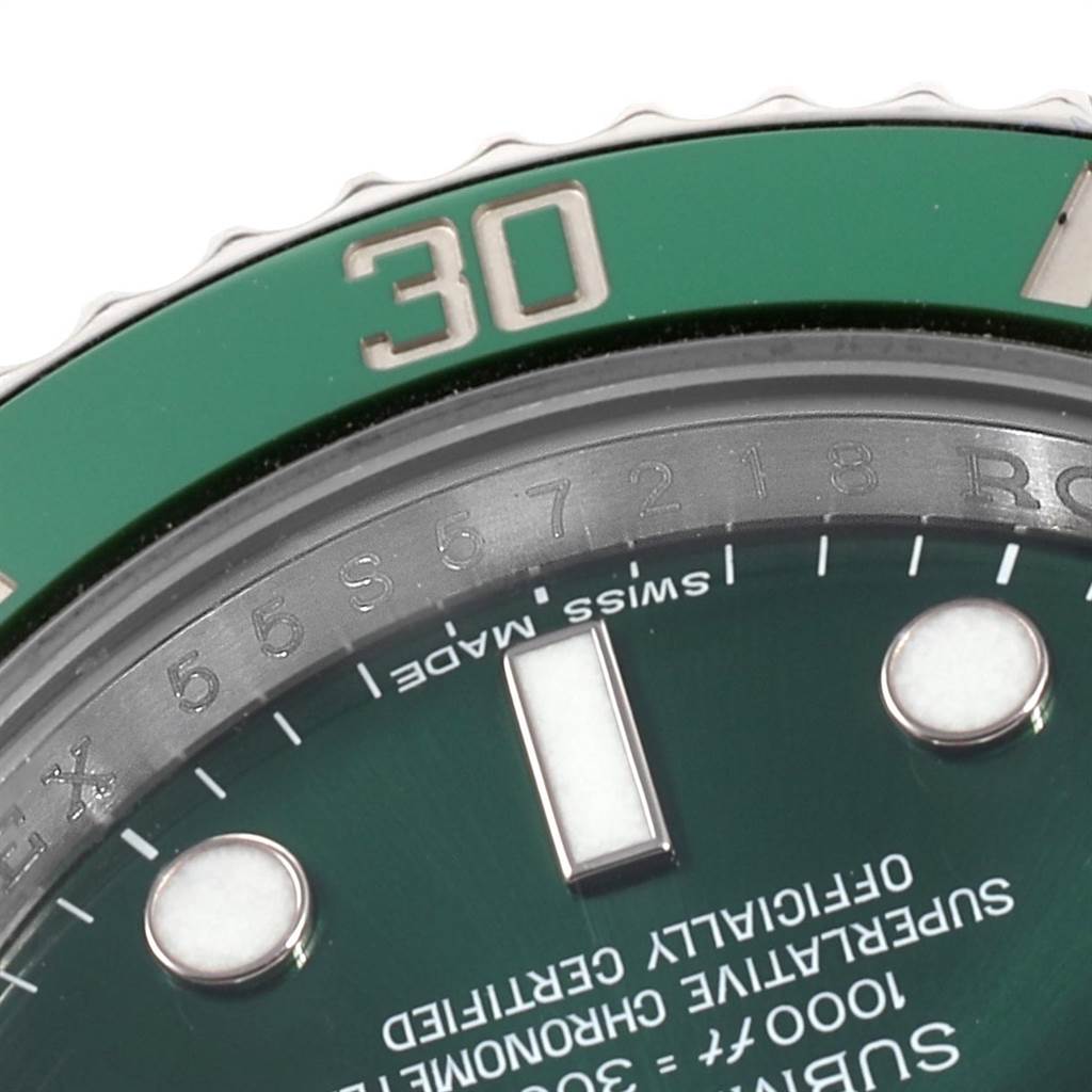 The image shows a close-up of the green bezel, part of the dial, and markings of the Rolex Submariner 116610LV Men
s Stainless Steel Green Dial 116610LV Men
s Stainless Steel Green Dial watch.