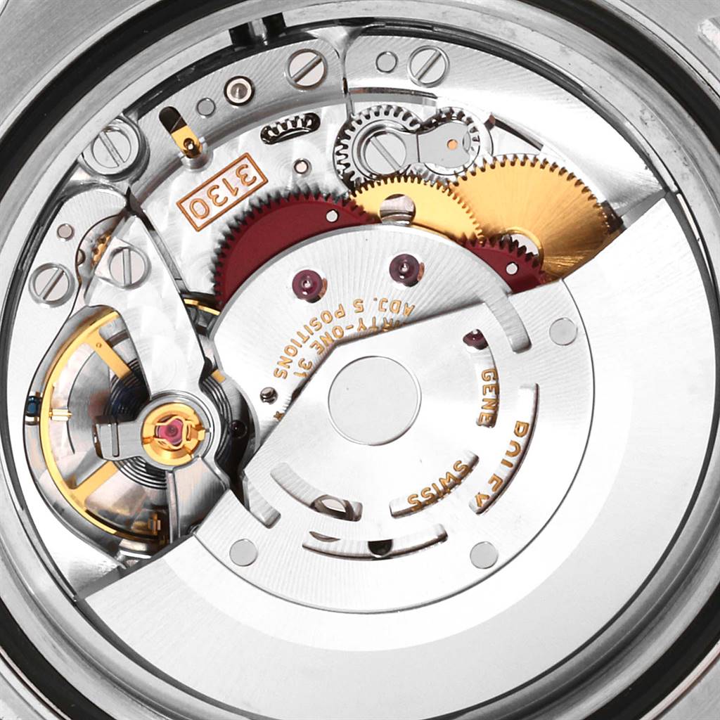 This image shows a close-up of the movement mechanism inside a Rolex Submariner 114060 Men's Stainless Steel Black Dial 114060 Men's Stainless Steel Black Dial watch with visible gears and components.