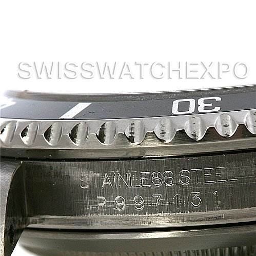 This image shows a close-up side view of the bezel and side detailing, including the engraved serial number, of a Rolex Submariner 16610 Men's Stainless Steel Black Dial 16610 Men's Stainless Steel Black Dial watch.
