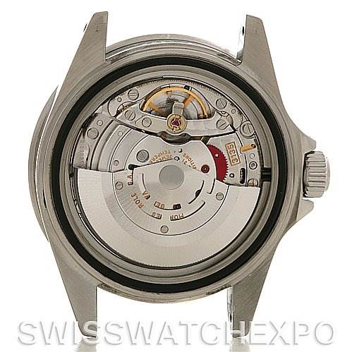 The image shows the back view of a Rolex Submariner 16610 Men's Stainless Steel Black Dial 16610 Men's Stainless Steel Black Dial watch case, revealing its movement and intricate internal components.