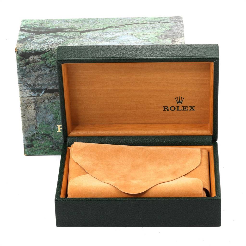 The image shows an open green Rolex box with a suede pouch, meant for a Rolex Submariner 14060 Men's Stainless Steel Black Dial 14060 Men's Stainless Steel Black Dial model watch, surrounded by a green textured outer box.