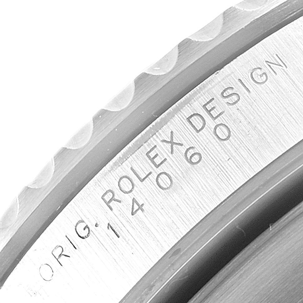 This image shows a close-up of the engraved case side of a Rolex Submariner 14060 Men's Stainless Steel Black Dial 14060 Men's Stainless Steel Black Dial watch, displaying the "Rolex Design" inscription and reference number.
